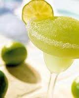 Frozen Lime Margarita with Salt Rim and Lime on Side
