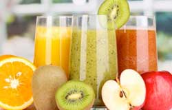 Orange, Kiwi and Apple Juice in Glasses